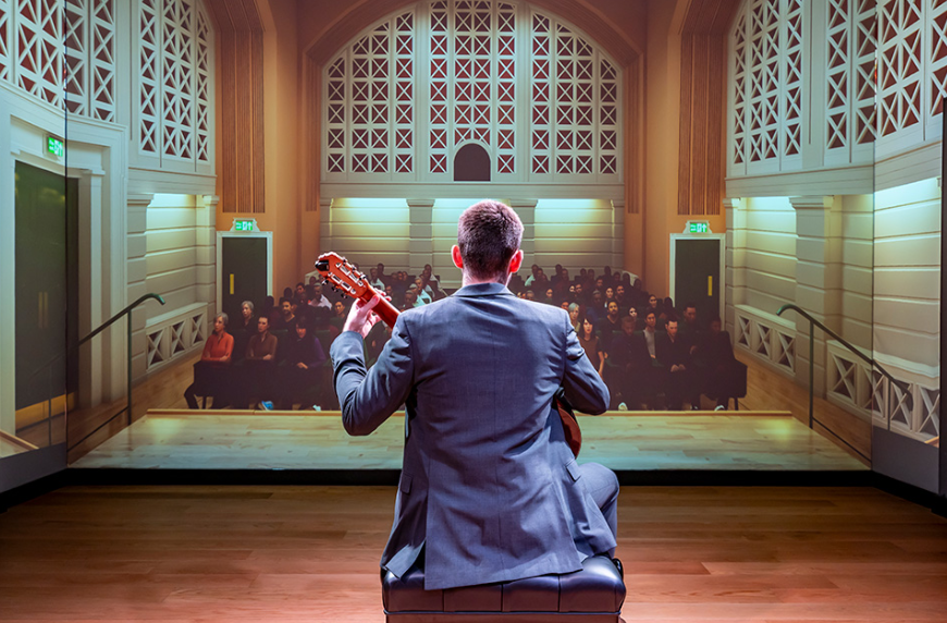 An RCM student performing to a virtual audience in the RCM Performance Laboratory